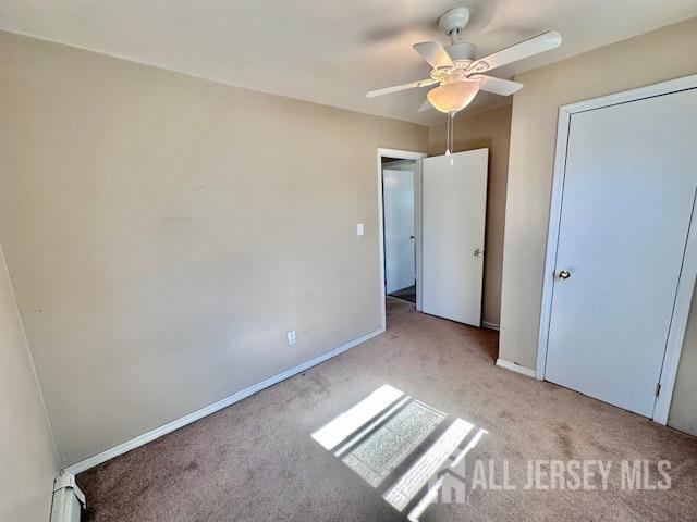 111 Main Street Helmetta, NJ 08828 - Photo 32 of 42 an empty room with windows and fan