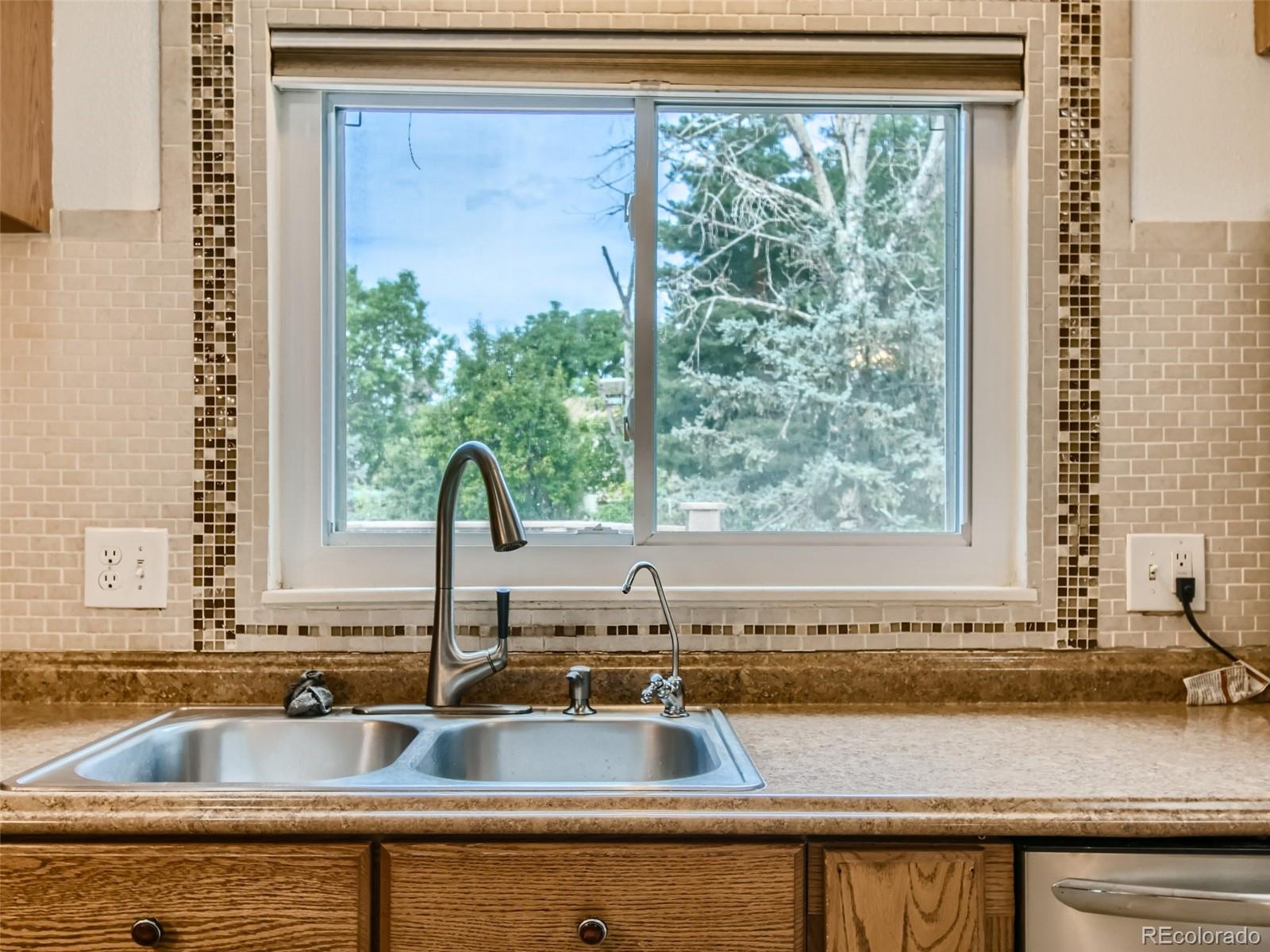 11111 Hudson Place Thornton, CO 80233 - Photo 13 of 28 a view of a sink and a large window