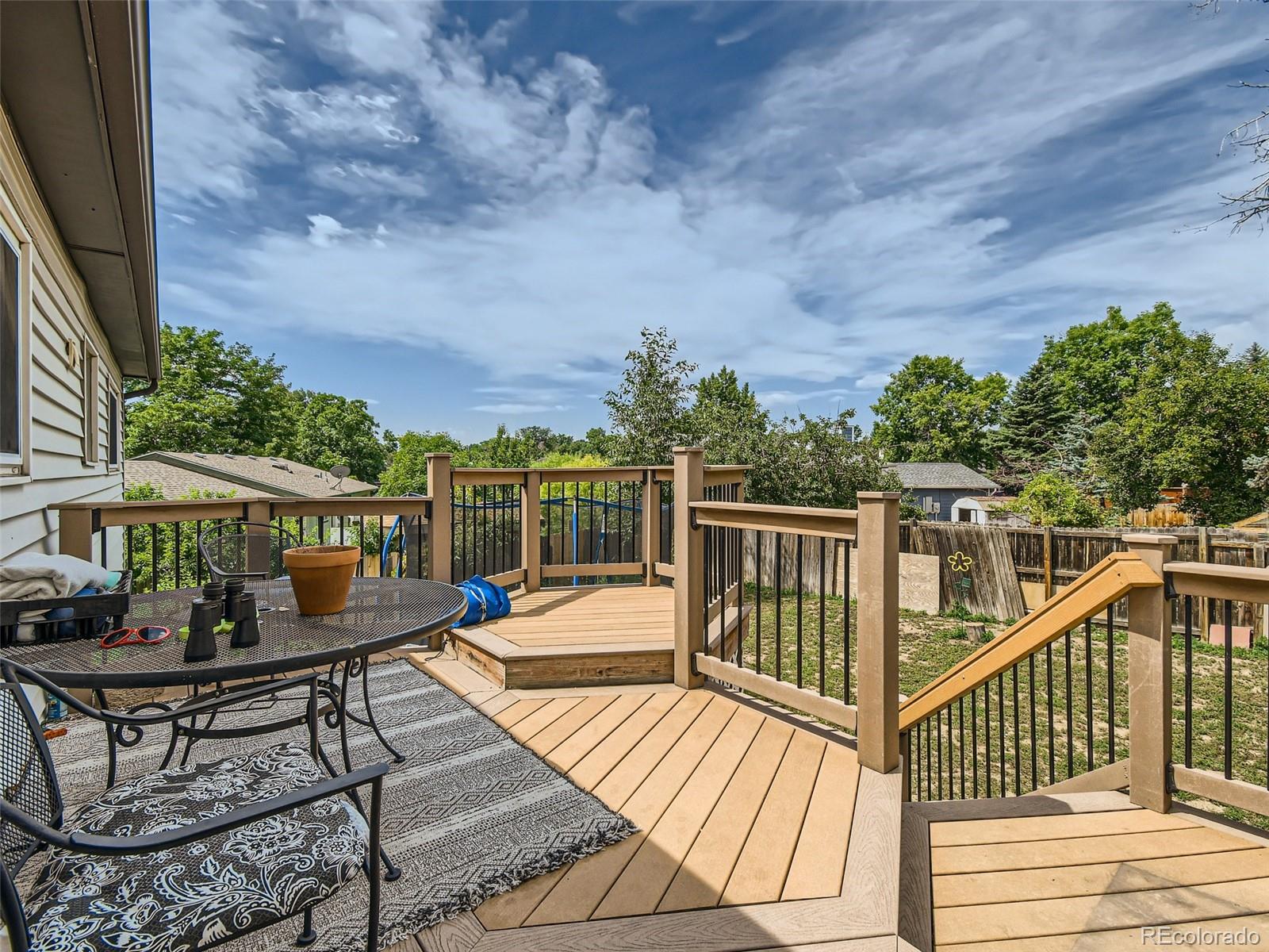 11111 Hudson Place Thornton, CO 80233 - Photo 27 of 28 a view of a chairs and table on the wooden floor