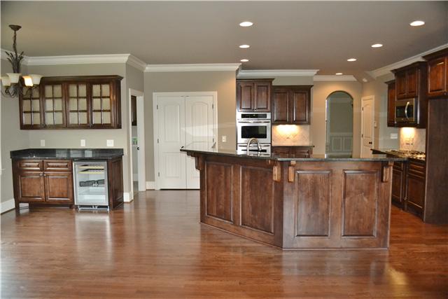 2073 Autumn Ridge Way Spring Hill, TN 37174 - Photo 7 of 20 Kitchen from hearth rm; view to Formal Dining room and Living room. Custom Kitchen cabinetry, Eat-in area on left w/ Hutch and beverage cooler!!