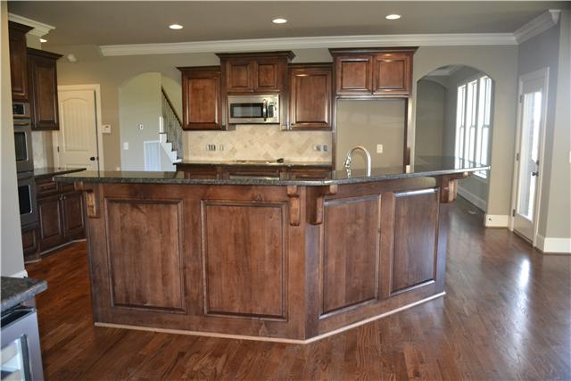2073 Autumn Ridge Way Spring Hill, TN 37174 - Photo 8 of 20 Kitchen w/ granite tops; stainless appliances; lots of custom cabinetry; open to Formal dining room and Living room!