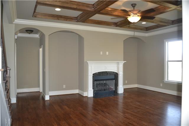 2073 Autumn Ridge Way Spring Hill, TN 37174 - Photo 9 of 20 Living room w/ Fireplace; hall to Master Bedroom suite and half bath in hall. Gorgeous coffered ceiling!
