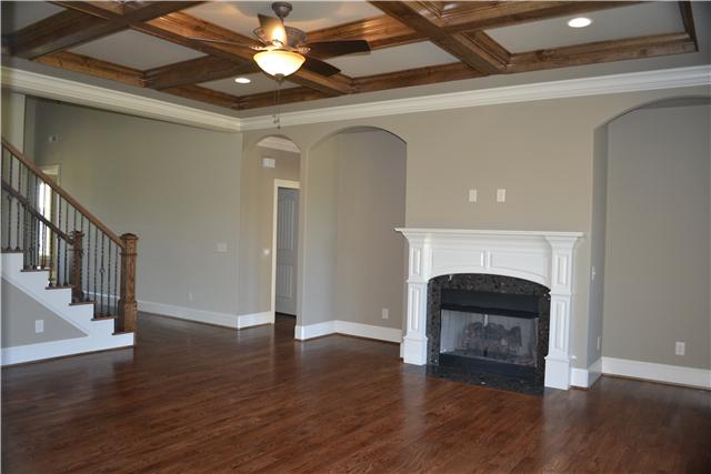 2073 Autumn Ridge Way Spring Hill, TN 37174 - Photo 10 of 20 view of the living room from the other side of the kitchen. Master Bedroom is across from stairway. Half bath door is ajar.