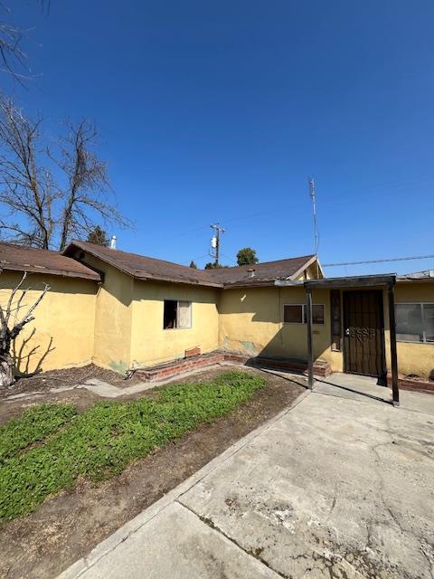 217 South 7th Street Fowler, CA 93625 - Photo 2 of 5 a front view of a house with a yard and garage