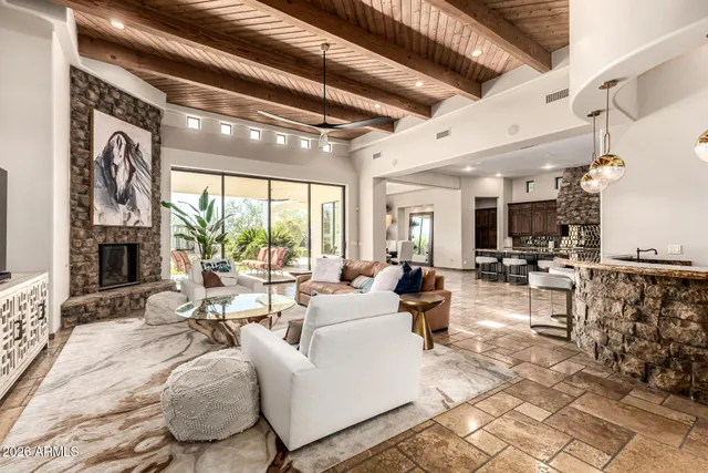 a living room with furniture and a potted plant