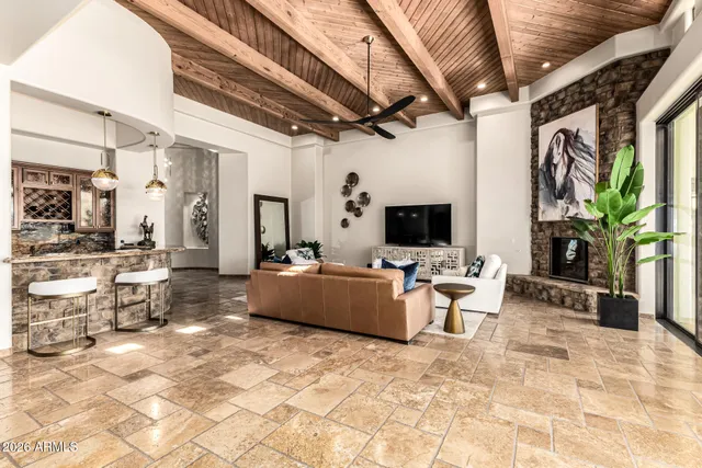 a kitchen with stainless steel appliances granite countertop a refrigerator and a stove top oven