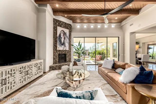 a bathroom with a granite countertop sink mirror and bathtub