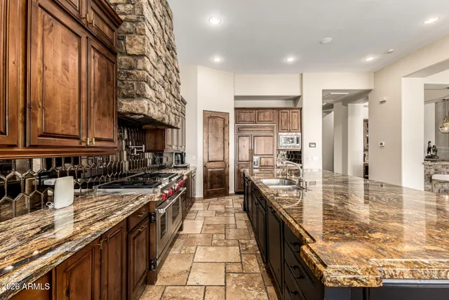 a bathroom with a granite countertop sink mirror and double
