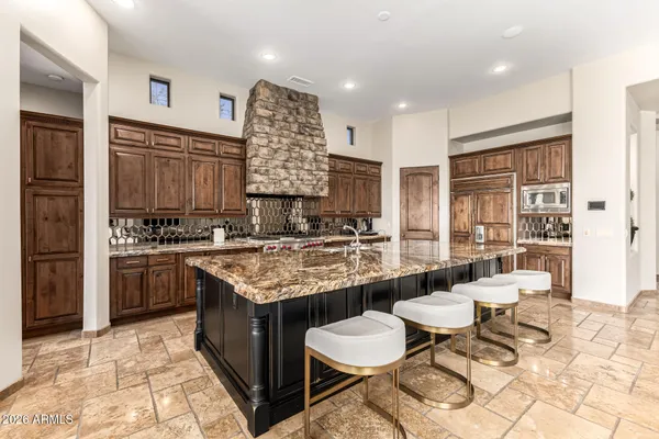 a bathroom with a granite countertop sink mirror and double