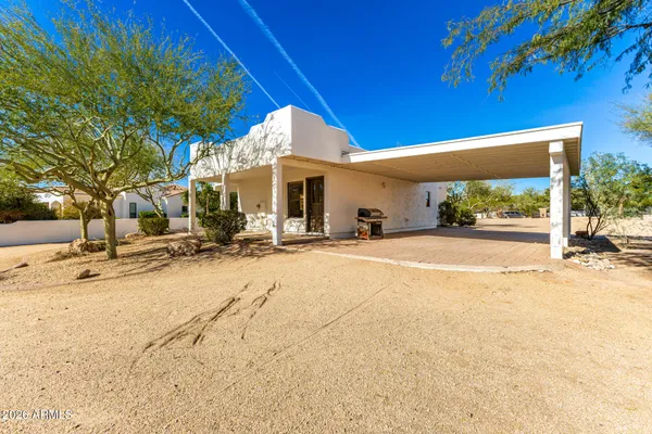 a front view of a house with a patio