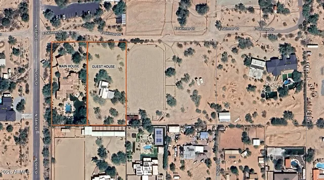 a living room with furniture a flat screen tv and a large window