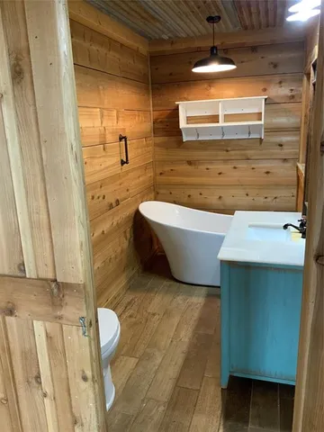 a bathroom with a bathtub and shower