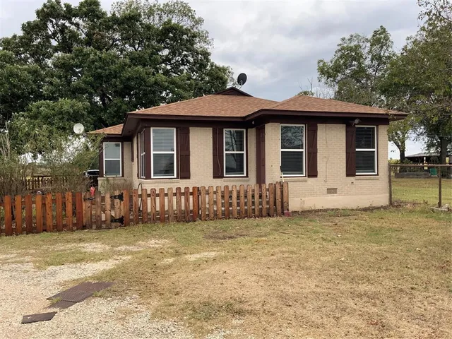 a front view of a house with a garage