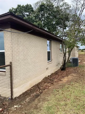 a backyard of a house with seating space