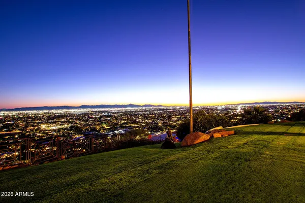 a room with furniture projector and screen