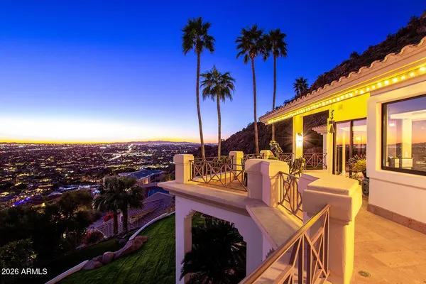 a view of a patio with couches table and chairs and potted plants