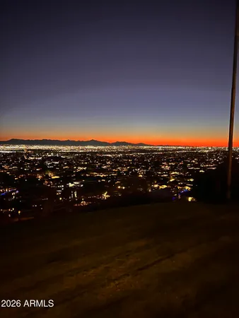 a view of a house with a backyard and a tub