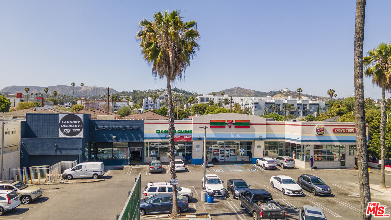 5609 West Sunset Boulevard Los Angeles, CA 90028 - Photo 3 of 8 a city street filled with lots of traffic and cars