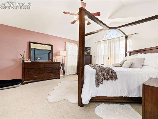 5346 Gentle Wind Road Colorado Springs, CO 80922 - Photo 22 of 28 Bedroom featuring a ceiling fan, carpet flooring, and lofted ceiling
