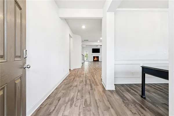 a view of a livingroom with furniture window and wooden floor