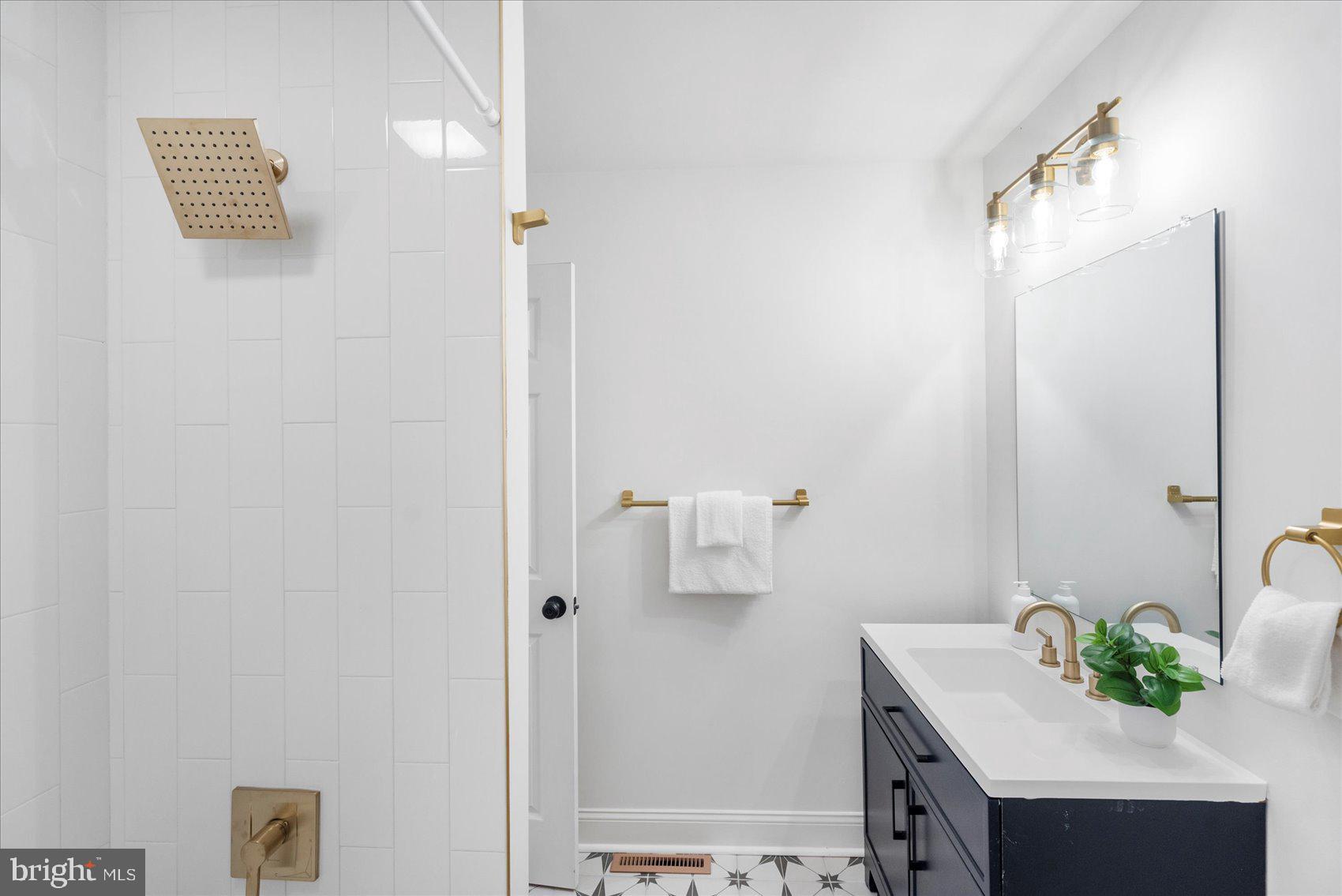 226 Mt Royal Avenue Aberdeen, MD 21001 - Photo 39 of 48 a bathroom with a sink and a mirror