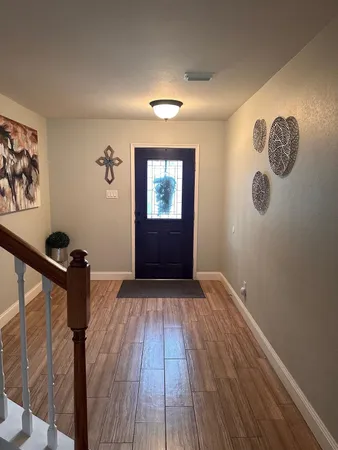 a view of a livingroom with wooden floor