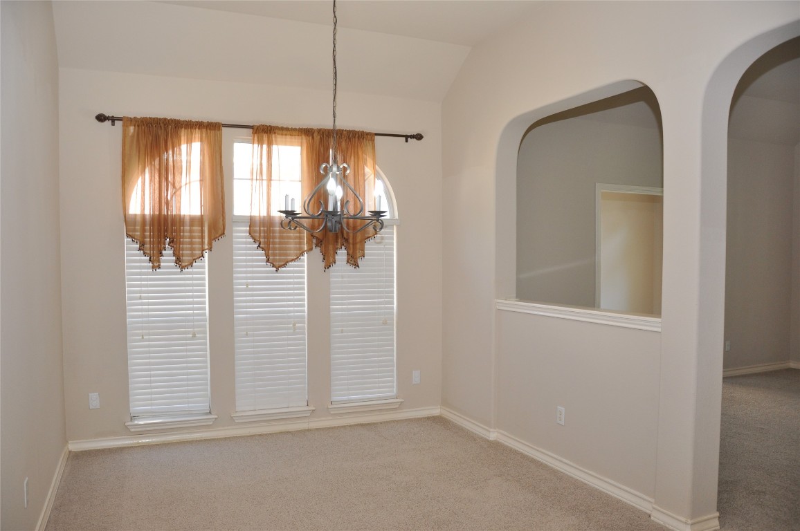 16616 Dalmahoy Drive Austin, TX 78717 - Photo 18 of 31 an empty room with wooden floor and windows
