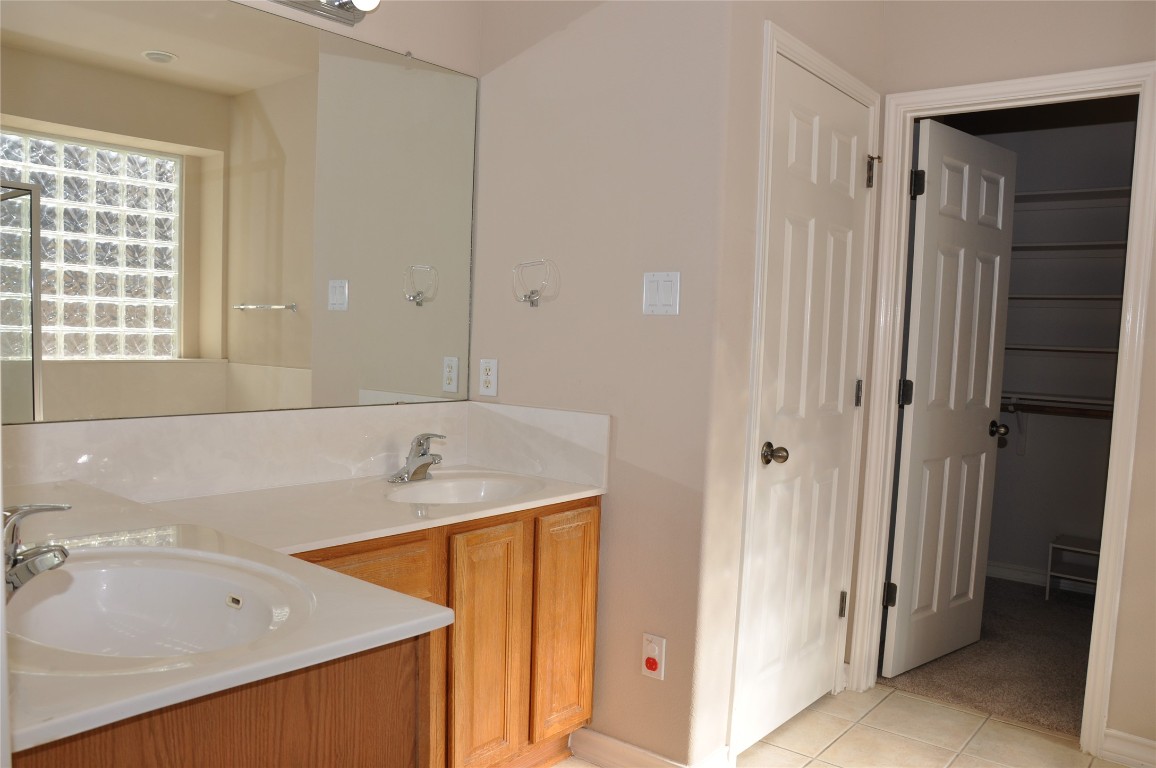 16616 Dalmahoy Drive Austin, TX 78717 - Photo 24 of 31 a bathroom with a tub sink and mirror