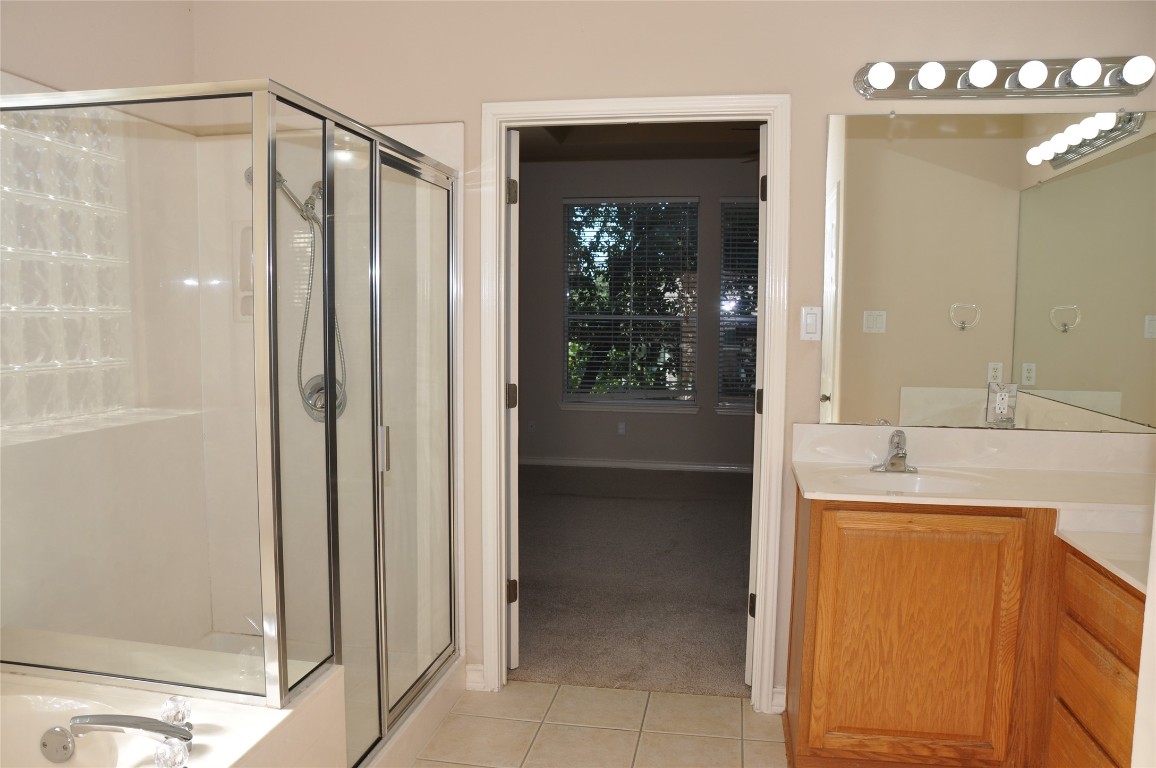 16616 Dalmahoy Drive Austin, TX 78717 - Photo 26 of 31 a bathroom with a shower and a sink