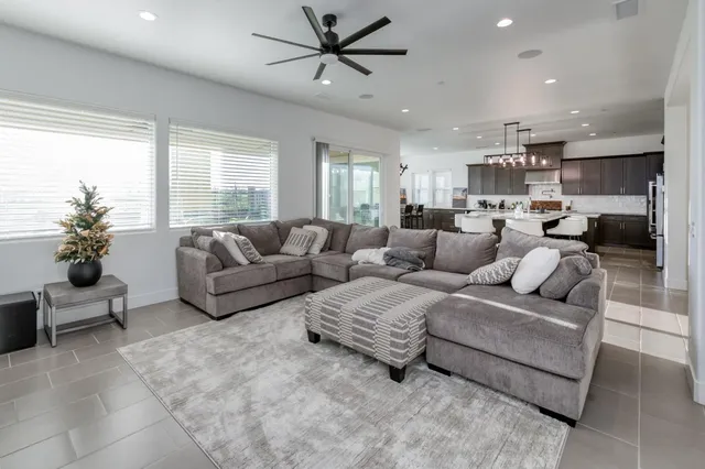 a dining room with a wooden table and chairs