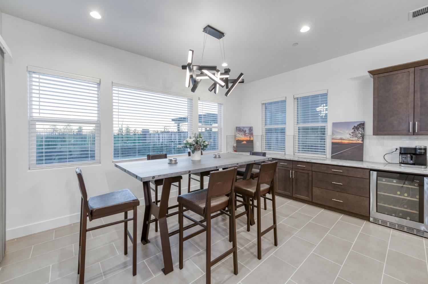 1042 Beaver Pond Loop Madera, CA 93636 - Photo 16 of 61 a dining room with a wooden table and chairs