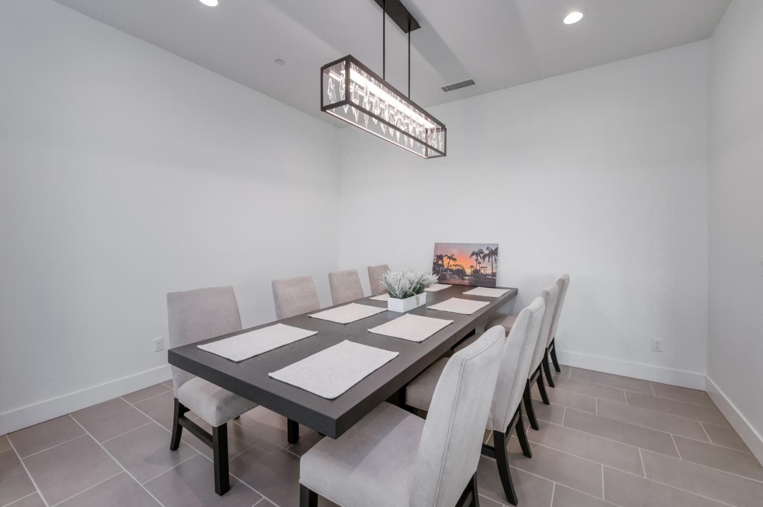 1042 Beaver Pond Loop Madera, CA 93636 - Photo 24 of 61 a view of a table and chairs in a room