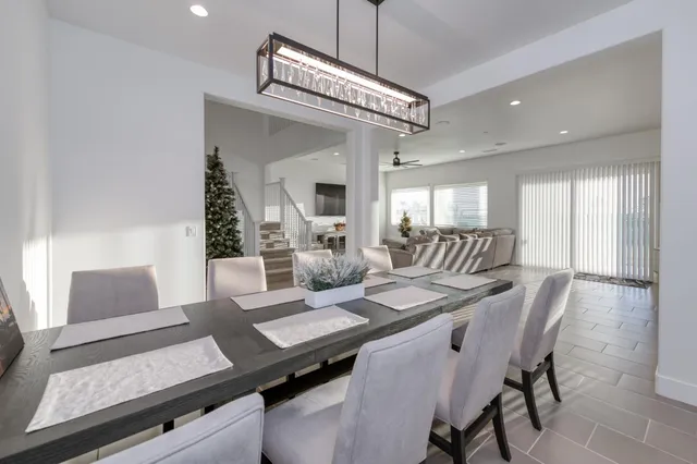 a living room with furniture a air conditioner and a window