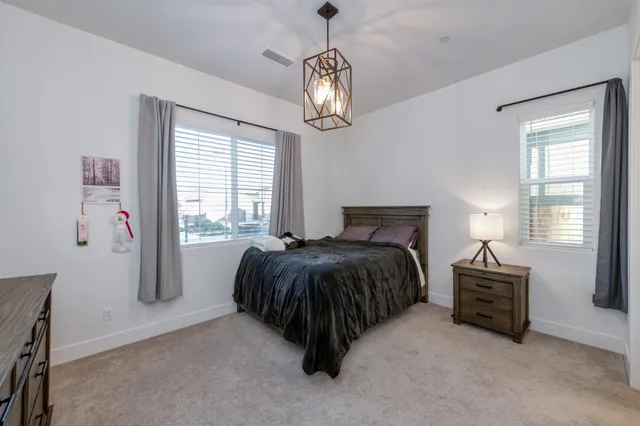 a bedroom with a bed and window