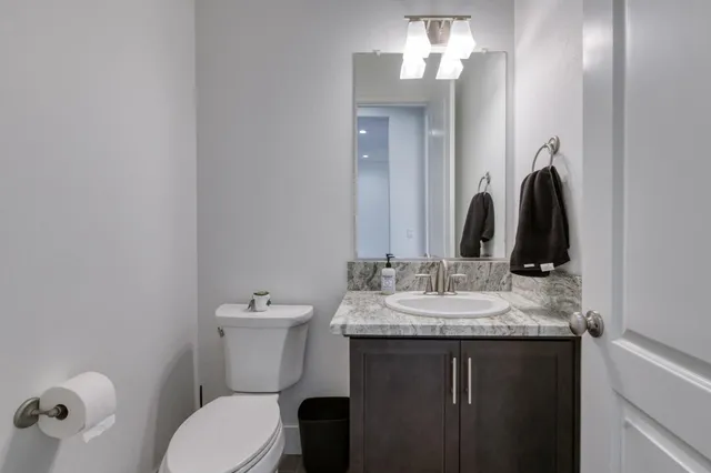 a bathroom with double sink and a mirror