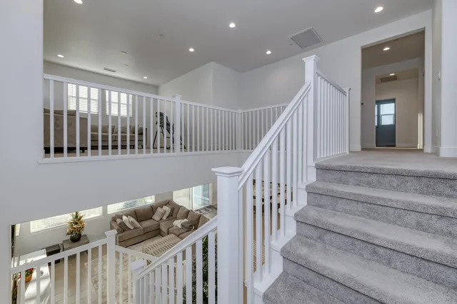 a utility room with sink dryer and washer