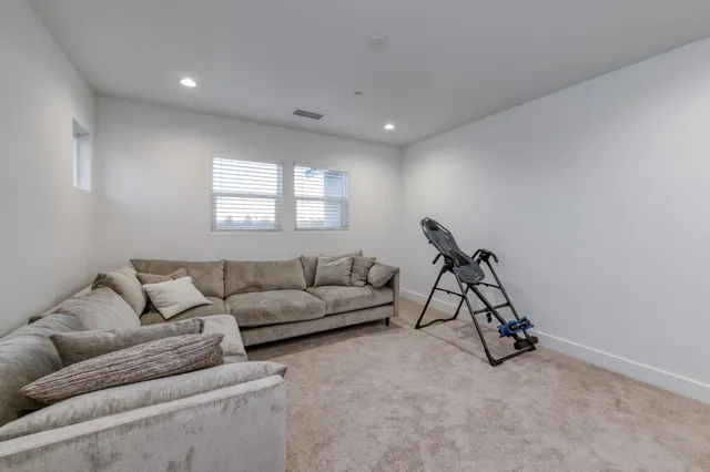a kitchen with sink a mirror and cabinets