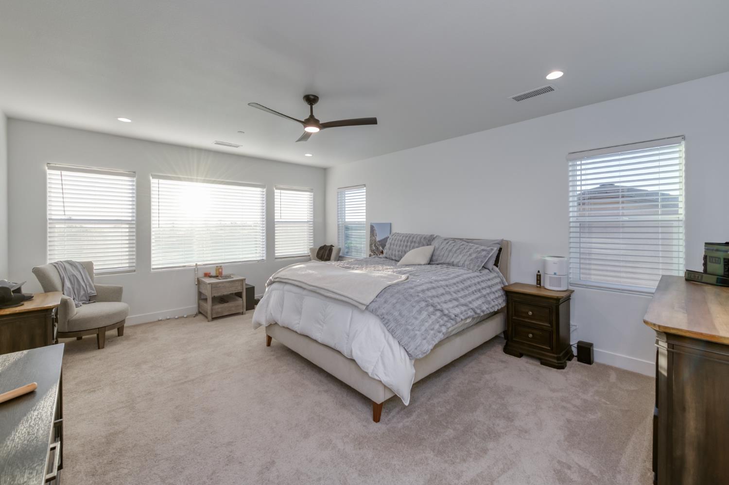 1042 Beaver Pond Loop Madera, CA 93636 - Photo 39 of 61 a bedroom with a bed and a couch