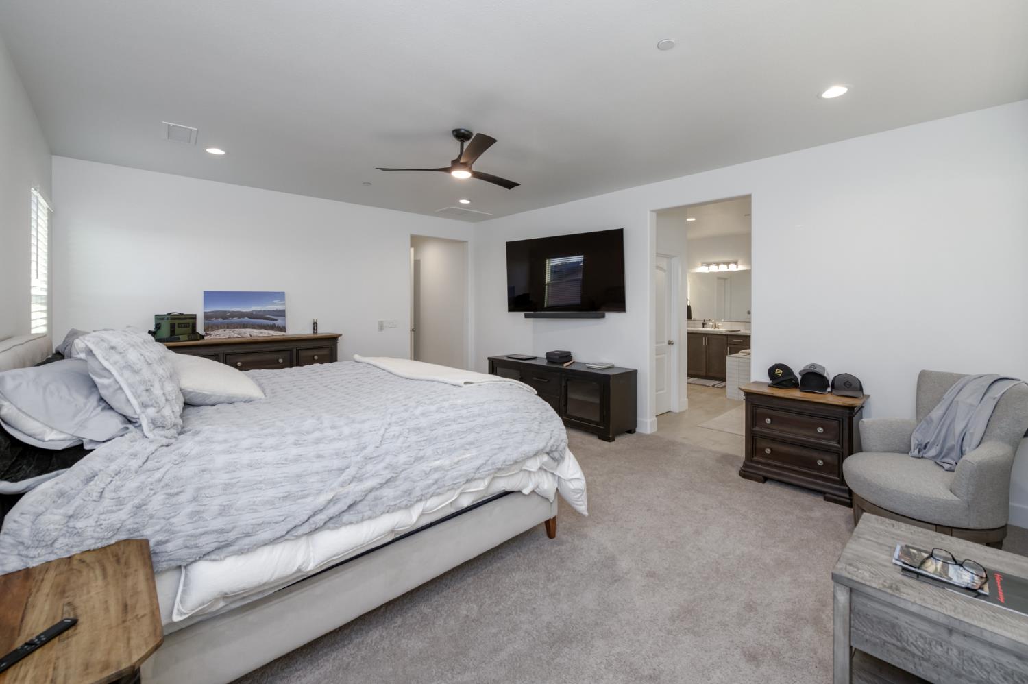 1042 Beaver Pond Loop Madera, CA 93636 - Photo 40 of 61 a bedroom with a bed and furniture