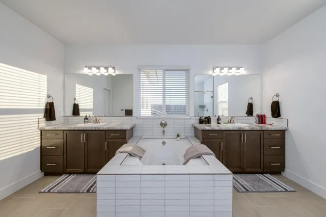 a view of a field of grass and a building