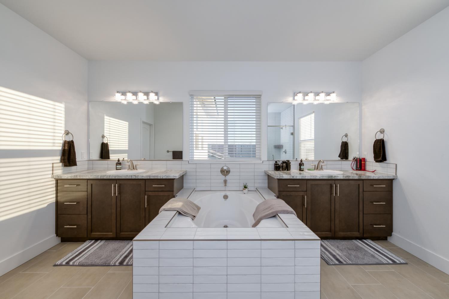 1042 Beaver Pond Loop Madera, CA 93636 - Photo 41 of 61 a kitchen with sink a mirror and cabinets