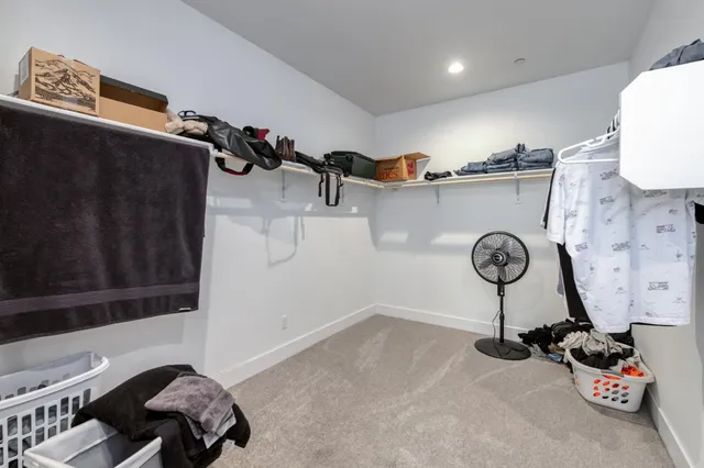a lobby with furniture and potted plants