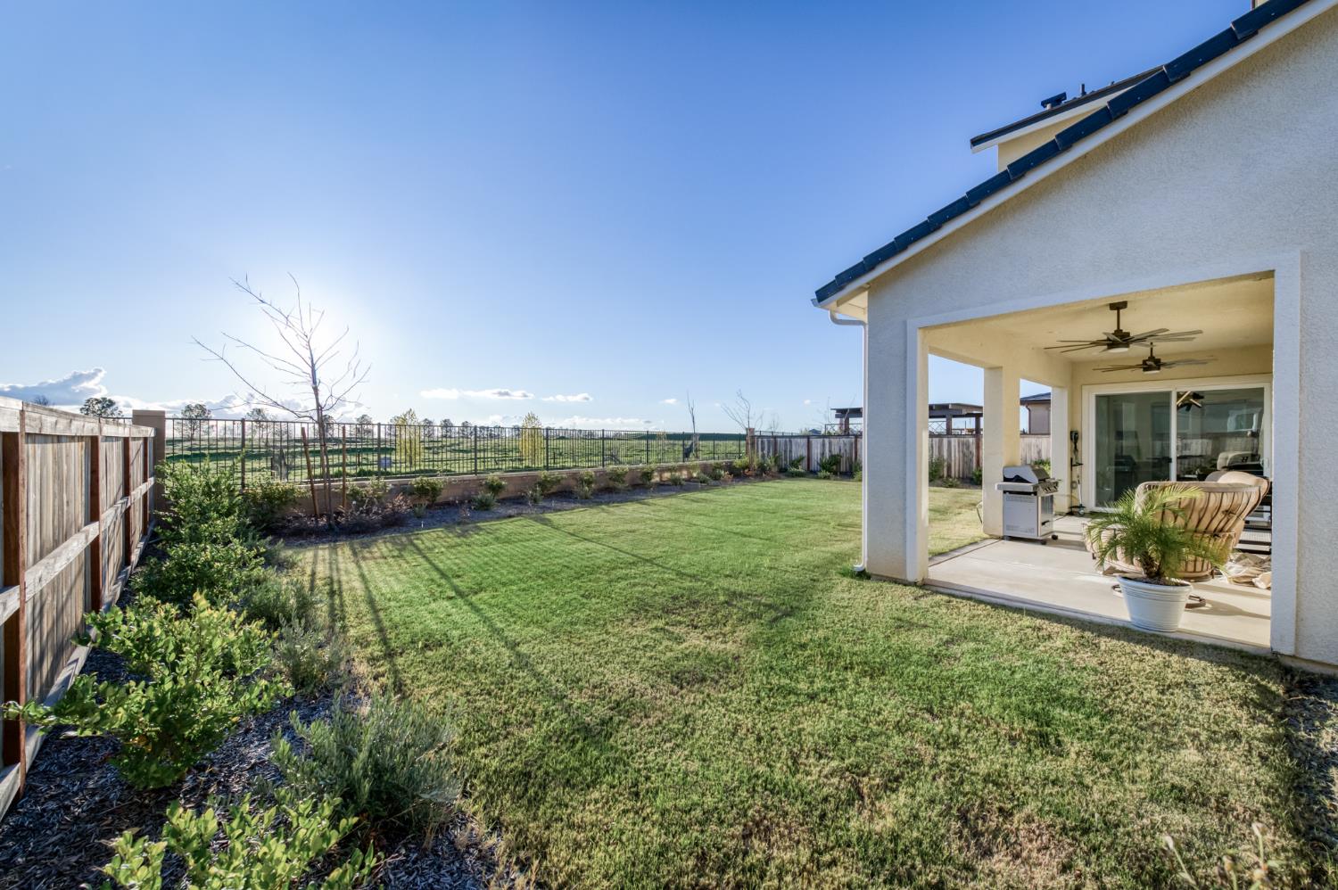 1042 Beaver Pond Loop Madera, CA 93636 - Photo 46 of 61 a view of a backyard with porch area