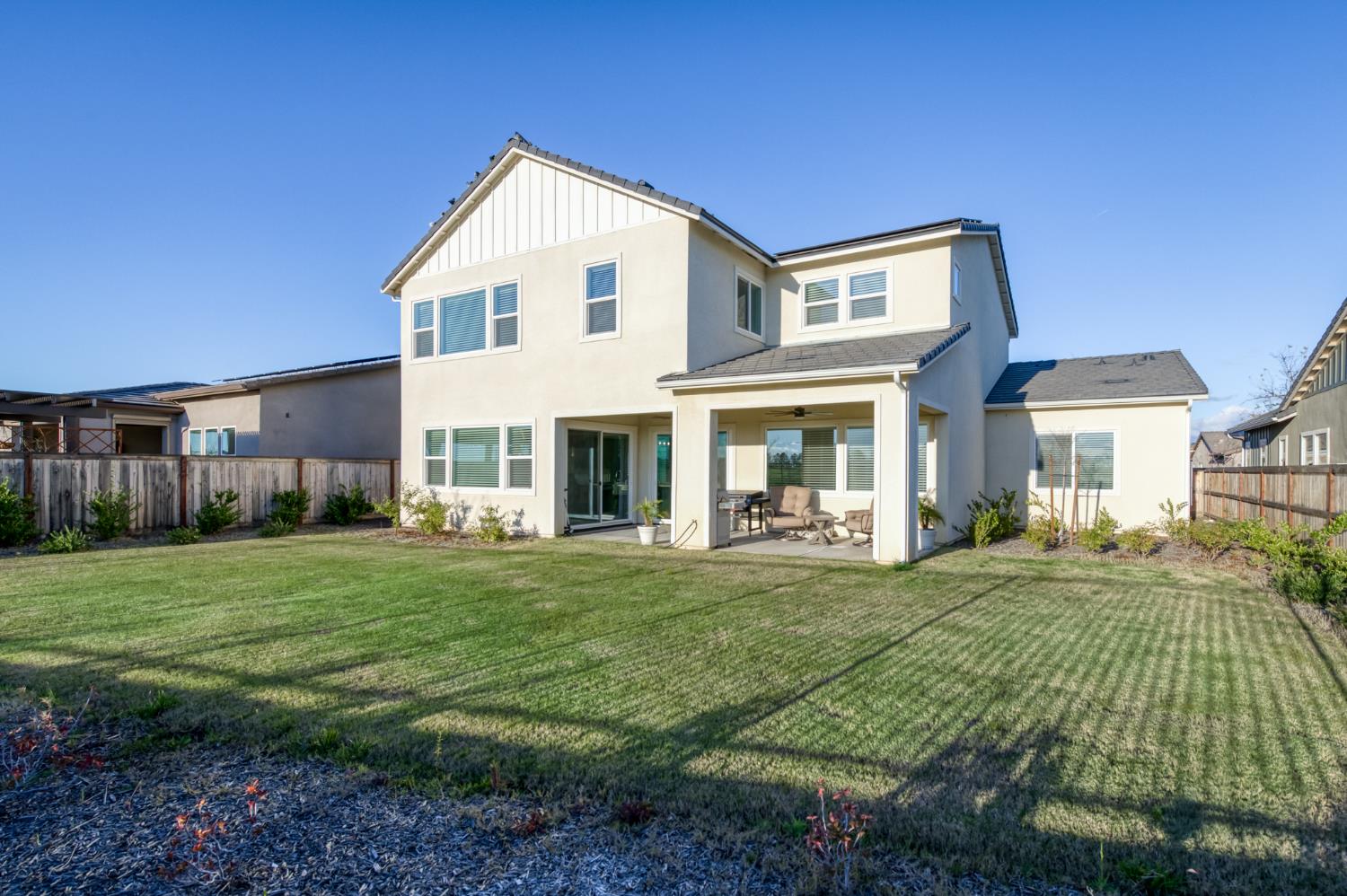 1042 Beaver Pond Loop Madera, CA 93636 - Photo 47 of 61 a front view of a house with a yard