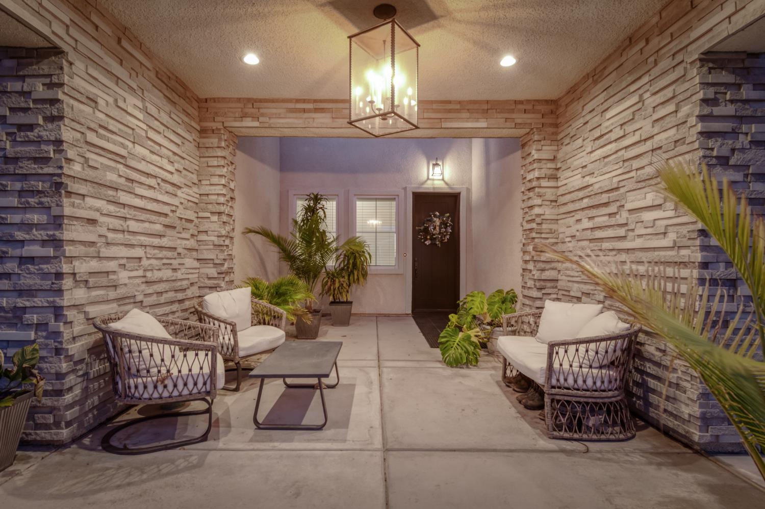 1042 Beaver Pond Loop Madera, CA 93636 - Photo 53 of 61 a lobby with furniture and potted plants