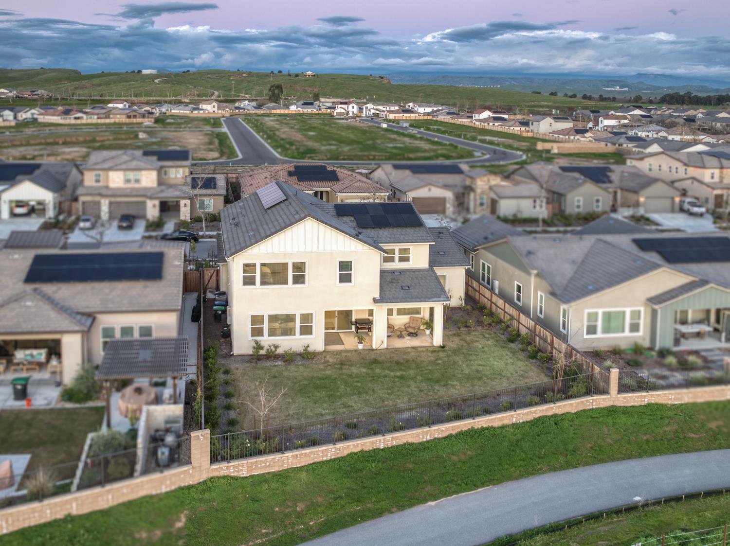 1042 Beaver Pond Loop Madera, CA 93636 - Photo 56 of 61 an aerial view of residential houses and city view