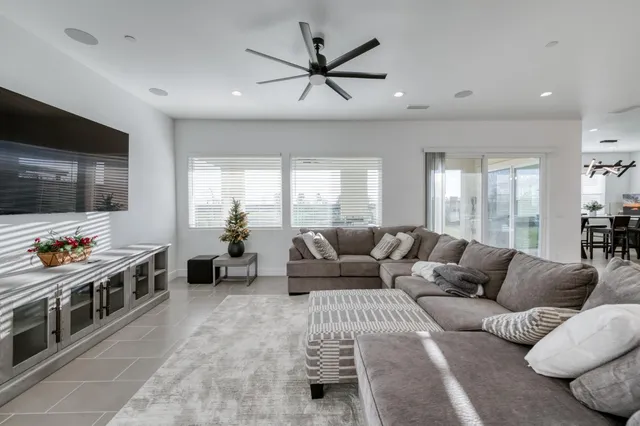 a living room with furniture and a large window