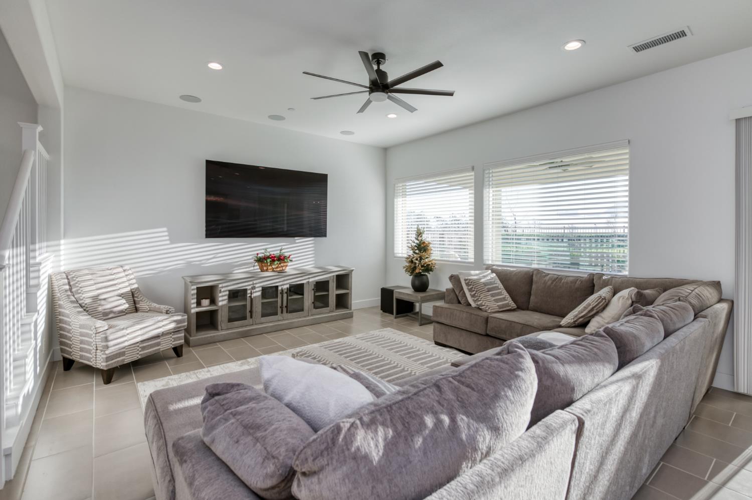 1042 Beaver Pond Loop Madera, CA 93636 - Photo 8 of 61 a living room with furniture and a flat screen tv