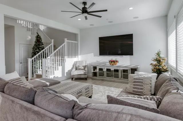 a living room with furniture and a large window
