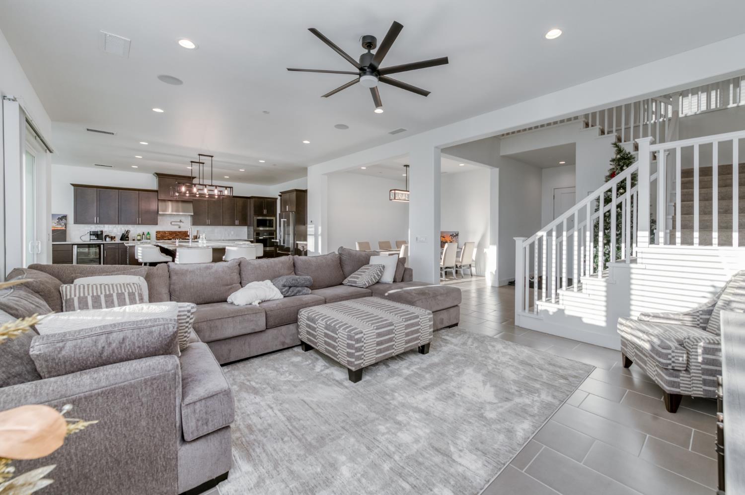 1042 Beaver Pond Loop Madera, CA 93636 - Photo 10 of 61 a living room with furniture and a view of kitchen
